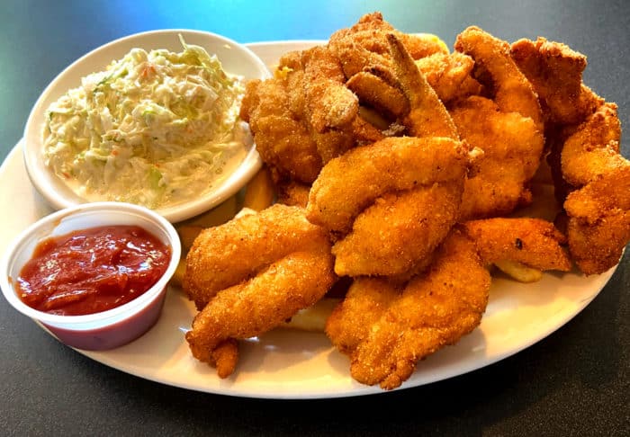 fried shrimp dish with coleslaw and cocktail sauce