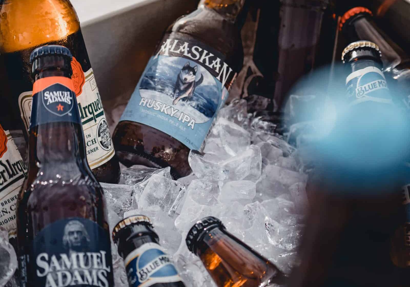 sam adams and blue moon beer available for takeout as a six pack
